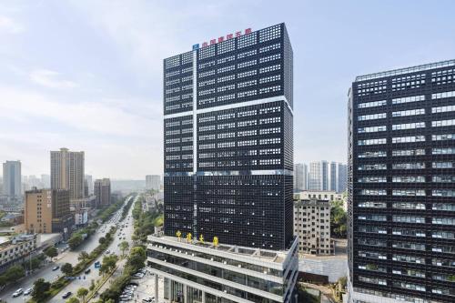 a view of a tall building in a city at Courtyard by Marriott Changsha South in Changsha