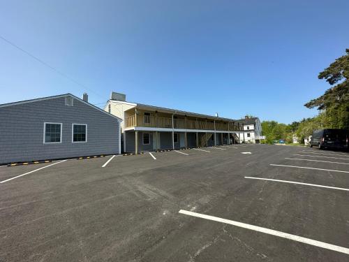 a parking lot in front of a building at Vacation Inn in Saco