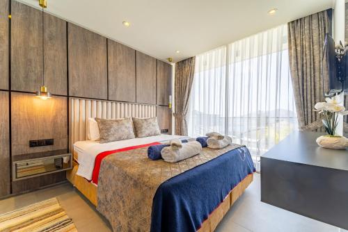 A bed or beds in a room at Villa Kazarman, Kalkan’ın kalbinde denize, merkeze