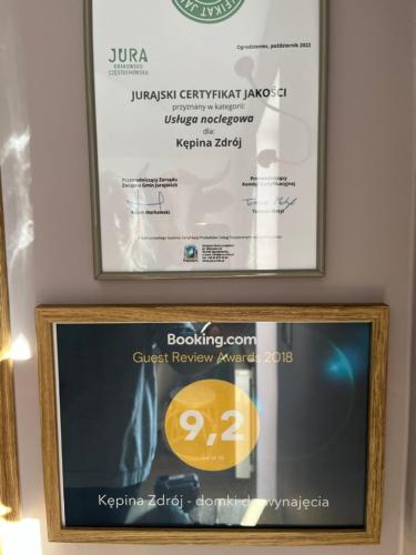 a framed picture of a ticket on a wall at Siedlisko Kępina Zdrój in Ostrów