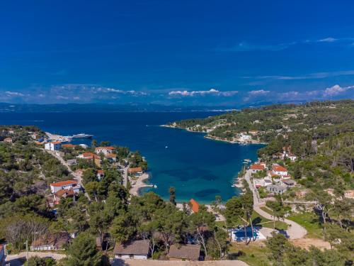 an aerial view of a lake at Uniquely designed Villa Ivana with outdoor Jacuzzi nearby the pebble Banje beach at the Island of Solta in Rogač