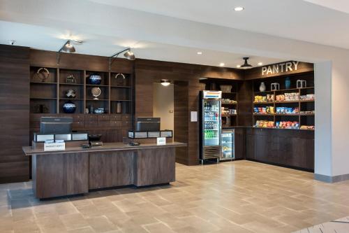 a retail store with a cash register and a pharmacy at Four Points by Sheraton Albany in Albany