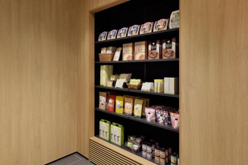 a pantry with a shelf with food on it at Fairfield by Marriott Mie Okuise Odai in Odaicho