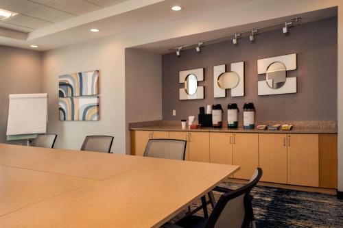 a conference room with a table and chairs at TownePlace Suites by Marriott Frederick in Frederick