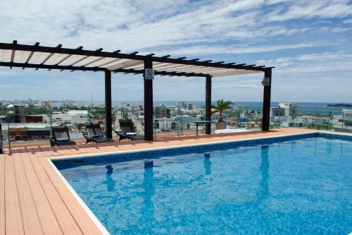 a swimming pool on the roof of a building at Four Points by Sheraton Veracruz in Veracruz