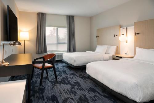 Кровать или кровати в номере Fairfield by Marriott Inn & Suites North Bay