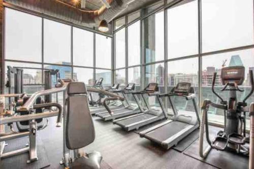 a gym with a bunch of treadmills at Opulence is a way of life in Dallas
