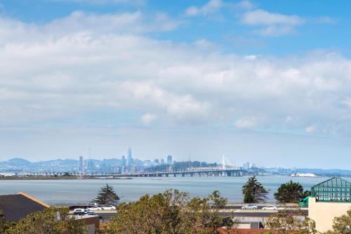 a view of a large body of water with a city at Four Points by Sheraton - San Francisco Bay Bridge in Emeryville