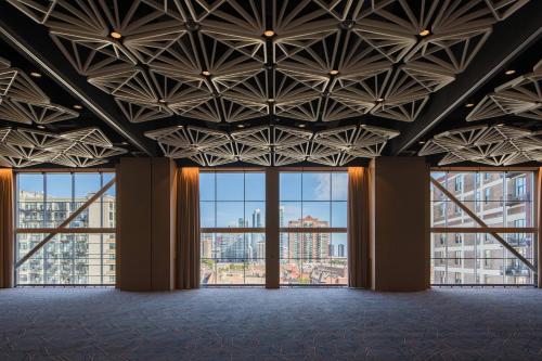 an empty room with large windows in a building at Marriott Marquis Chicago in Chicago