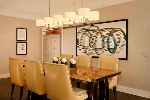 a dining room with a table and chairs at The Ritz-Carlton, Berlin in Berlin