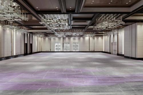 a large room with a purple floor and chandeliers at JW Marriott Marquis Hotel Shanghai Pudong in Shanghai