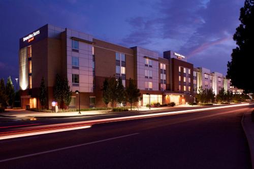 a building on the side of a street at night at SpringHill Suites Denver at Anschutz Medical Campus in Aurora