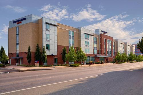 a large building on the side of a street at SpringHill Suites Denver at Anschutz Medical Campus in Aurora