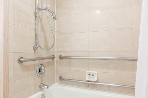 a bathroom with a shower and a bath tub at Sheraton Sonoma Wine Country Petaluma in Petaluma