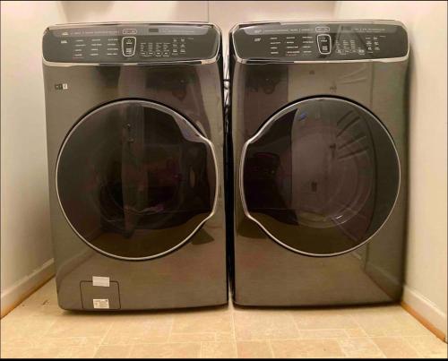two washing machines are sitting next to each other at Van Gogh Guest Rm#6 • Van Gogh 6- Private BSMT Rm in single family home in Rosedale
