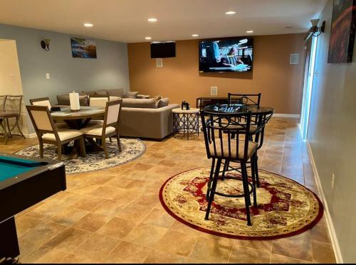 a living room with a pool table and a couch at Van Gogh Guest Rm#6 • Van Gogh 6- Private BSMT Rm in single family home in Rosedale