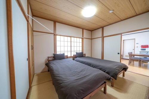 Posteľ alebo postele v izbe v ubytovaní コーポセキヤ / Corp Sekiya