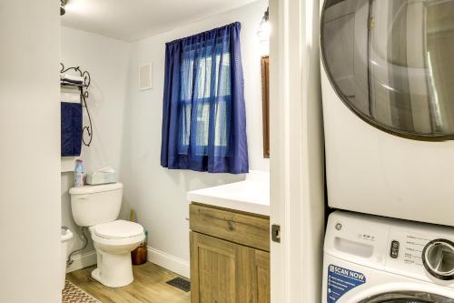 a bathroom with a toilet and a washing machine at Peaceful Country Home in Serene Setting with Yard in Washington