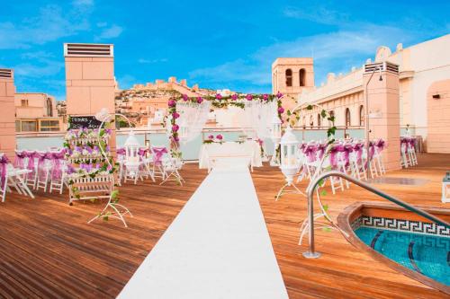 a wedding ceremony on the rooftop of a resort at AC Hotel Almería by Marriott in Almería