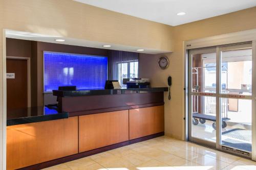 an office with a reception desk in a building at AmericInn by Wyndham St Cloud MN Shopping Area in Saint Cloud