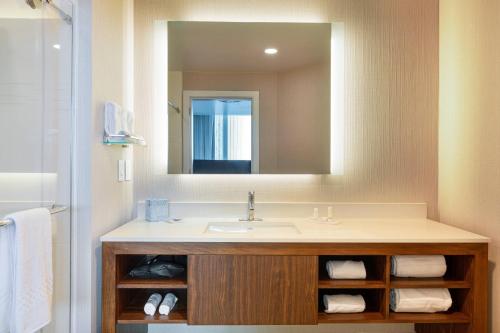 a bathroom with a sink and a mirror at Residence Inn by Marriott Panama City in Panama City