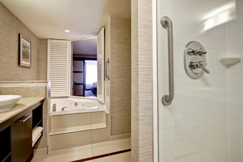 a bathroom with a shower and a sink at Fairfield Inn & Suites by Marriott Guelph in Guelph
