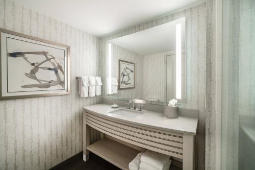 a bathroom with a sink and a mirror at Residence Inn by Marriott Portsmouth Downtown in Portsmouth