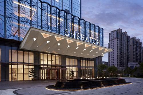 a building with a sign that reads sheraton at Sheraton Fuqing Hotel in Rongcheng