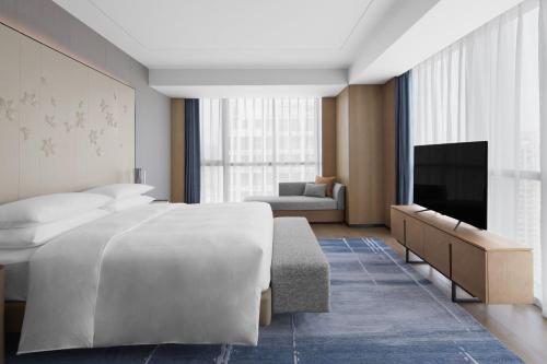 Postel nebo postele na pokoji v ubytování Sheraton Fuqing Hotel
