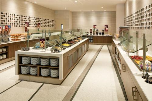 a large kitchen with a buffet of food at Residence Inn by Marriott at Anaheim Resort/Convention Center in Anaheim