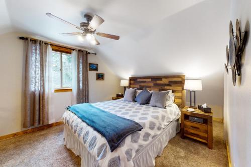 a bedroom with a bed and a ceiling fan at Pine Lantern Retreat in South Lake Tahoe