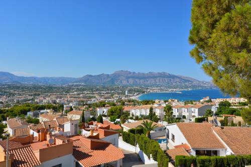 a view of a town with houses and a lake at Villa Alegria by NRAS in Albir