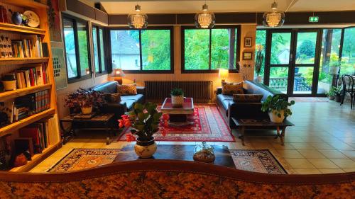 a large living room with a couch and a table at Les Rochers in Saint-Savin