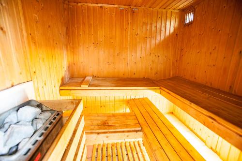an inside of a wooden sauna with two benches at Rewita Rogowo k Kołobrzegu in Rogowo