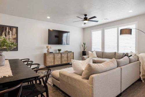 a living room with a couch and a dining room at Desert Daydream townhouse in St. George
