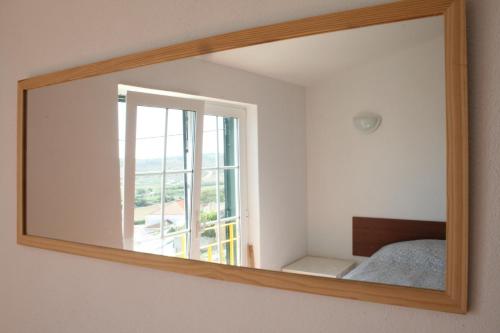 Postel nebo postele na pokoji v ubytování Casa da Praia do Amado