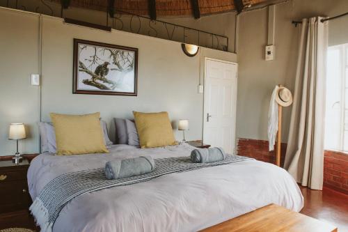 a large bed with two pillows on top of it at Makongo Hills Lodge in Magudu