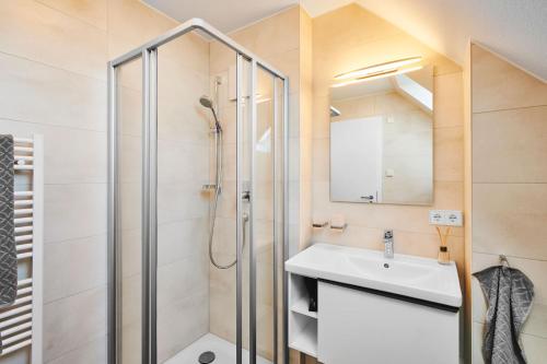 a bathroom with a shower and a sink at Gästehaus Bosch in Herrenberg