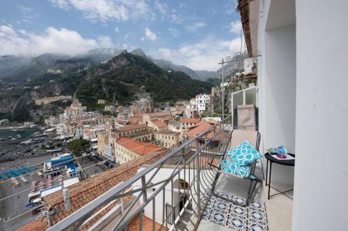 a balcony with a view of a city at Casa del Duca in Amalfi