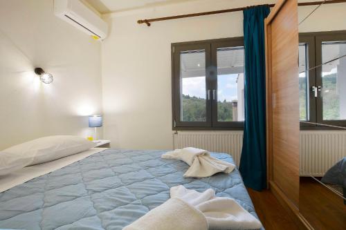 Postel nebo postele na pokoji v ubytování Balukas House
