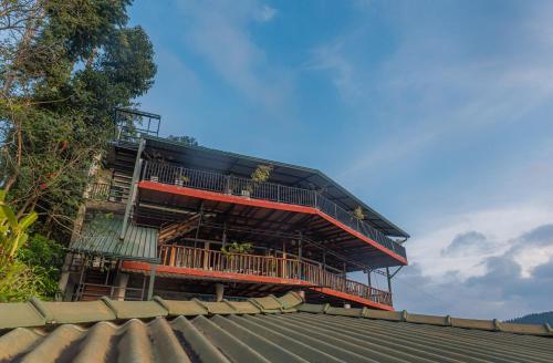 a building with balconies on top of a roof at Ravana Range Ella in Ella