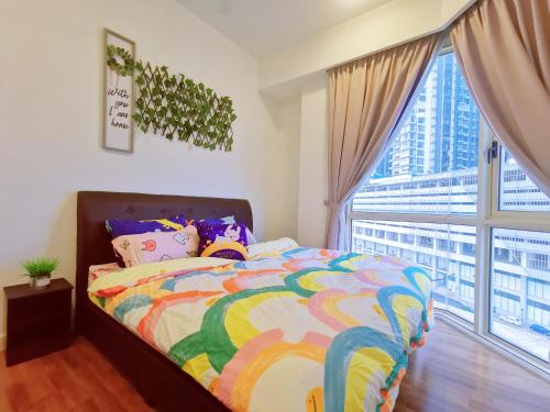 a bedroom with a bed and a large window at Legoland-3min Walk-HappyDream Suite at Afiniti -8pax-Cozy,Comfy&Convenience 2BR with Bathub in Nusajaya