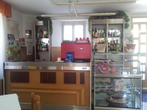 a kitchen with a counter and a refrigerator at La Colombella in Montemonaco