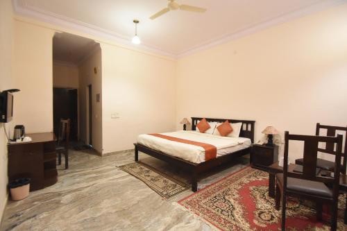 Ένα ή περισσότερα κρεβάτια σε δωμάτιο στο Satyam Palace Resort