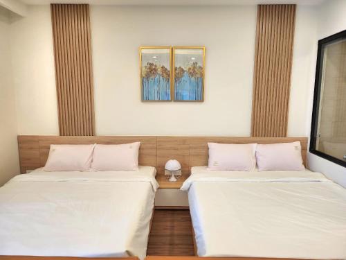 Postel nebo postele na pokoji v ubytování Quy Nhon Pearl - FLC Sea Tower