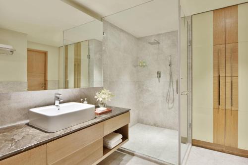 a bathroom with a sink and a shower at Fairfield by Marriott Amritsar in Amritsar