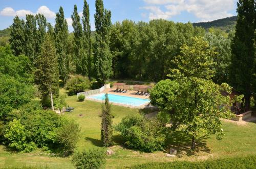 an aerial view of a garden with a swimming pool at Logis Hôtels Le Saint Marc in Mollans-sur-Ouvèze