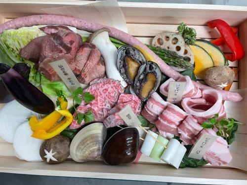 a drawer filled with different types of meat and vegetables at chillout glamping zao in Zao