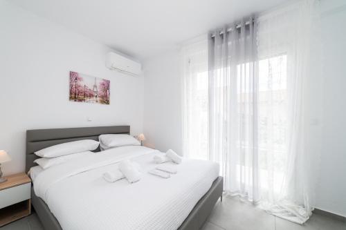 Postel nebo postele na pokoji v ubytování Perla Residential Complex