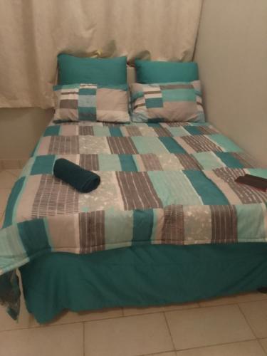 Postel nebo postele na pokoji v ubytování TL YAHWEH GUEST HOUSE
